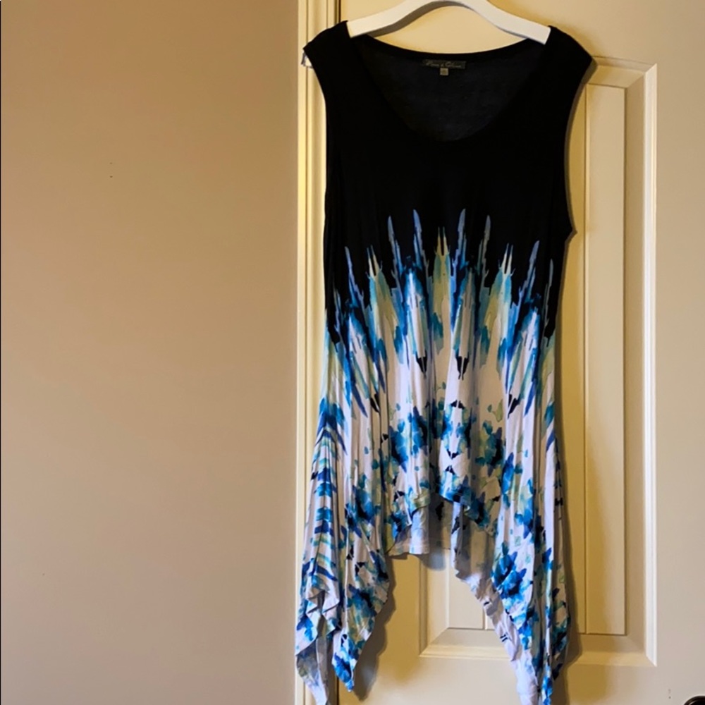 Sleeveless shark-bite hem swing top
